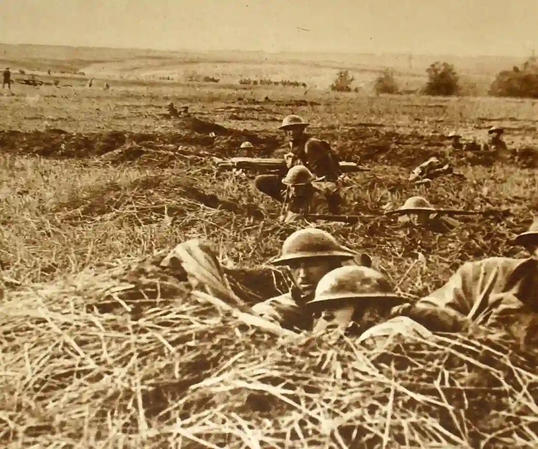 Sepia photograph of World War I soldiers lying in a field